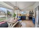 Bright eat-in kitchen with blue and white cabinets and stainless appliances at 646 S Joplin St, Aurora, CO 80017