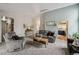 Open concept living room featuring easy access to the kitchen and vaulted ceilings at 646 S Joplin St, Aurora, CO 80017