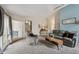Inviting living room featuring vaulted ceilings, neutral tones, and stylish decor at 646 S Joplin St, Aurora, CO 80017