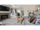 Cozy living area with a fireplace, comfortable seating, and access to the backyard at 646 S Joplin St, Aurora, CO 80017