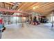 Unfinished basement featuring concrete walls, exposed ceiling, and ample open space at 8720 E 163Rd Pl, Brighton, CO 80602