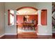 Formal dining room featuring hardwood floors, large dining table and decorative columns at 8720 E 163Rd Pl, Brighton, CO 80602