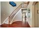 Elegant foyer with hardwood floors, staircase, and views leading into other rooms at 8720 E 163Rd Pl, Brighton, CO 80602