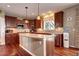 Updated kitchen featuring a large island, granite countertops, stainless steel appliances and wooden cabinetry at 8720 E 163Rd Pl, Brighton, CO 80602