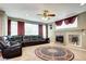 Comfortable living room featuring a fireplace, plush seating, and a decorative rug at 8720 E 163Rd Pl, Brighton, CO 80602