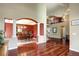 Open-concept living room with hardwood floors and seamless flow to other living spaces at 8720 E 163Rd Pl, Brighton, CO 80602