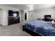 Bright main bedroom with large dresser, walk-in closet, and neutral wall color at 603 Jewel St, Brighton, CO 80603
