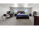 Expansive main bedroom with two windows, neutral carpet, and a king-size bed at 603 Jewel St, Brighton, CO 80603