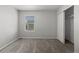 Neutral bedroom with carpet floors, closet, and bright window bringing in lots of light at 603 Jewel St, Brighton, CO 80603