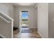 Bright entryway features wood floors, coat closet and open view of the front yard at 603 Jewel St, Brighton, CO 80603