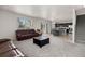 Open concept living room flows into the kitchen and dining areas at 603 Jewel St, Brighton, CO 80603