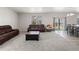 Spacious living room filled with comfy couches and natural light at 603 Jewel St, Brighton, CO 80603