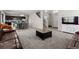 Open concept living room with stairs, and open access to dining and kitchen at 603 Jewel St, Brighton, CO 80603