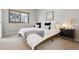 The bedroom features a large window providing natural light and modern decor at 345 Fillmore St # 203, Denver, CO 80206