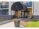 Stylish condo entrance featuring a covered awning and comfortable seating at 345 Fillmore St # 203, Denver, CO 80206