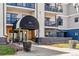 Stylish condo entrance featuring a covered awning and comfortable seating at 345 Fillmore St # 203, Denver, CO 80206