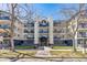 Exterior shot of multi-story condo building with well-maintained landscaping at 345 Fillmore St # 203, Denver, CO 80206