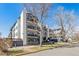 Attractive building exterior with architectural details, multiple balconies, and a well-kept lawn at 345 Fillmore St # 203, Denver, CO 80206