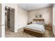 This secondary bedroom features neutral paint, closet and en-suite laundry at 2763 W Riverwalk Cir # B, Littleton, CO 80123