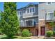 Charming townhome with stone accents, a balcony, manicured lawn and mature shade tree at 2763 W Riverwalk Cir # B, Littleton, CO 80123
