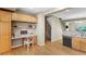 Bright, open kitchen features a built-in desk, eat-in bar and stainless steel dishwasher at 2763 W Riverwalk Cir # B, Littleton, CO 80123