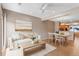 Bright living room with modern decor, hardwood floors, and a dining area at 2763 W Riverwalk Cir # B, Littleton, CO 80123