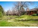 Large grassy backyard with mature trees at 2615 Oak Dr # 7, Lakewood, CO 80215