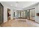 Spacious bath with elegant frosted glass shower, bench seating and natural light at 2615 Oak Dr # 7, Lakewood, CO 80215