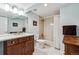 Bathroom featuring cherry vanity and marble tile flooring at 2615 Oak Dr # 7, Lakewood, CO 80215
