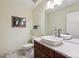 Bathroom featuring a vessel sink, a framed picture, and marble floors at 2615 Oak Dr # 7, Lakewood, CO 80215