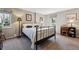 Bedroom with black metal bed frame, light colored walls, natural light, and carpet at 2615 Oak Dr # 7, Lakewood, CO 80215
