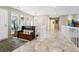 Bright hallway featuring marble floors, neutral colors, and a stylish bench at 2615 Oak Dr # 7, Lakewood, CO 80215