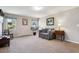 Neutral living room with carpet, light colored walls, lots of natural light, and tastefully decorated at 2615 Oak Dr # 7, Lakewood, CO 80215