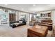 Large living room featuring hardwood floors, an entertainment area, leather furniture, and lots of natural light at 2615 Oak Dr # 7, Lakewood, CO 80215