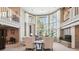 Bright living room featuring soaring windows and brick fireplace with seating at 2615 Oak Dr # 7, Lakewood, CO 80215