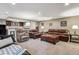 Great Gathering room with a bar area, neutral colored walls, hardwood floors and a comfortable seating area at 2615 Oak Dr # 7, Lakewood, CO 80215