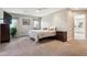 Spacious main bedroom featuring carpeted floors, neutral walls, and two large windows at 2615 Oak Dr # 7, Lakewood, CO 80215