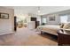 Main bedroom featuring carpeted floors, a ceiling fan, and an attached sitting area at 2615 Oak Dr # 7, Lakewood, CO 80215