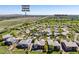 Aerial view of a home with the Colorado National Golf Club and neighborhood park in the distance at 4965 Bierstadt Loop, Broomfield, CO 80023