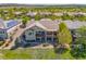 Aerial view of a home featuring a two-story deck, professional landscaping, and a view of the surrounding neighborhood at 4965 Bierstadt Loop, Broomfield, CO 80023