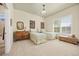 A bedroom with two twin beds, a dresser, a window with shutters, and decorations on the wall at 4965 Bierstadt Loop, Broomfield, CO 80023