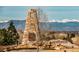 Community welcome monument with stone walls and views of snow-capped mountains at 4965 Bierstadt Loop, Broomfield, CO 80023