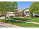 Well-kept home features a three-car garage and lush front lawn at 4965 Bierstadt Loop, Broomfield, CO 80023