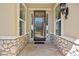 Elegant front entryway with stone accents and charming details at 4965 Bierstadt Loop, Broomfield, CO 80023