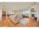 Spacious living room with hardwood floors, fireplace, and bright windows at 4965 Bierstadt Loop, Broomfield, CO 80023
