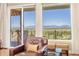 Living room window with sliding glass doors showcasing beautiful mountain views at 4965 Bierstadt Loop, Broomfield, CO 80023