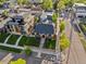 Aerial view of a beautiful house surrounded by green lawns, trees, and neighborhood streets at 4495 Utica St, Denver, CO 80212