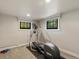 Basement fitness area with exercise equipment and natural light from windows at 4495 Utica St, Denver, CO 80212