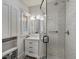 Modern bathroom featuring white subway tiles, a glass shower, and updated fixtures at 4495 Utica St, Denver, CO 80212