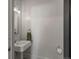 Classic powder room with a pedestal sink and white subway tile at 4495 Utica St, Denver, CO 80212